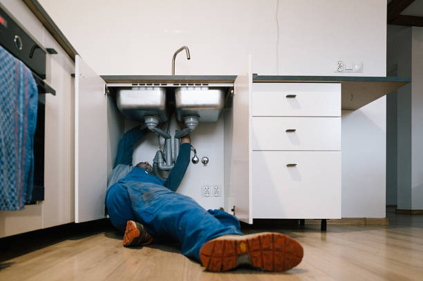 Professional Drain Cleaning technician working in Bell, CA
